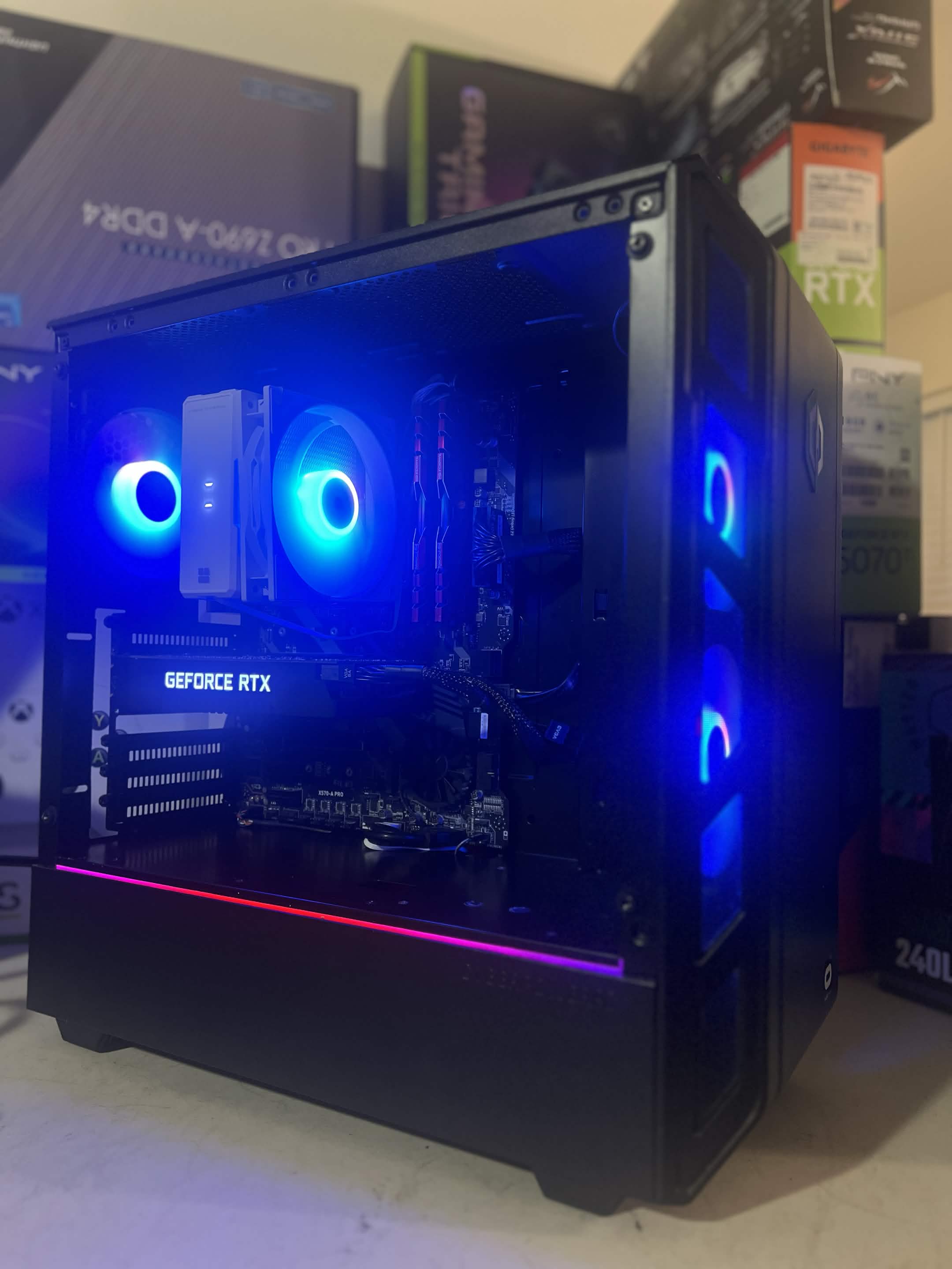 A glass-sided gaming PC with coordinated blue lighting.