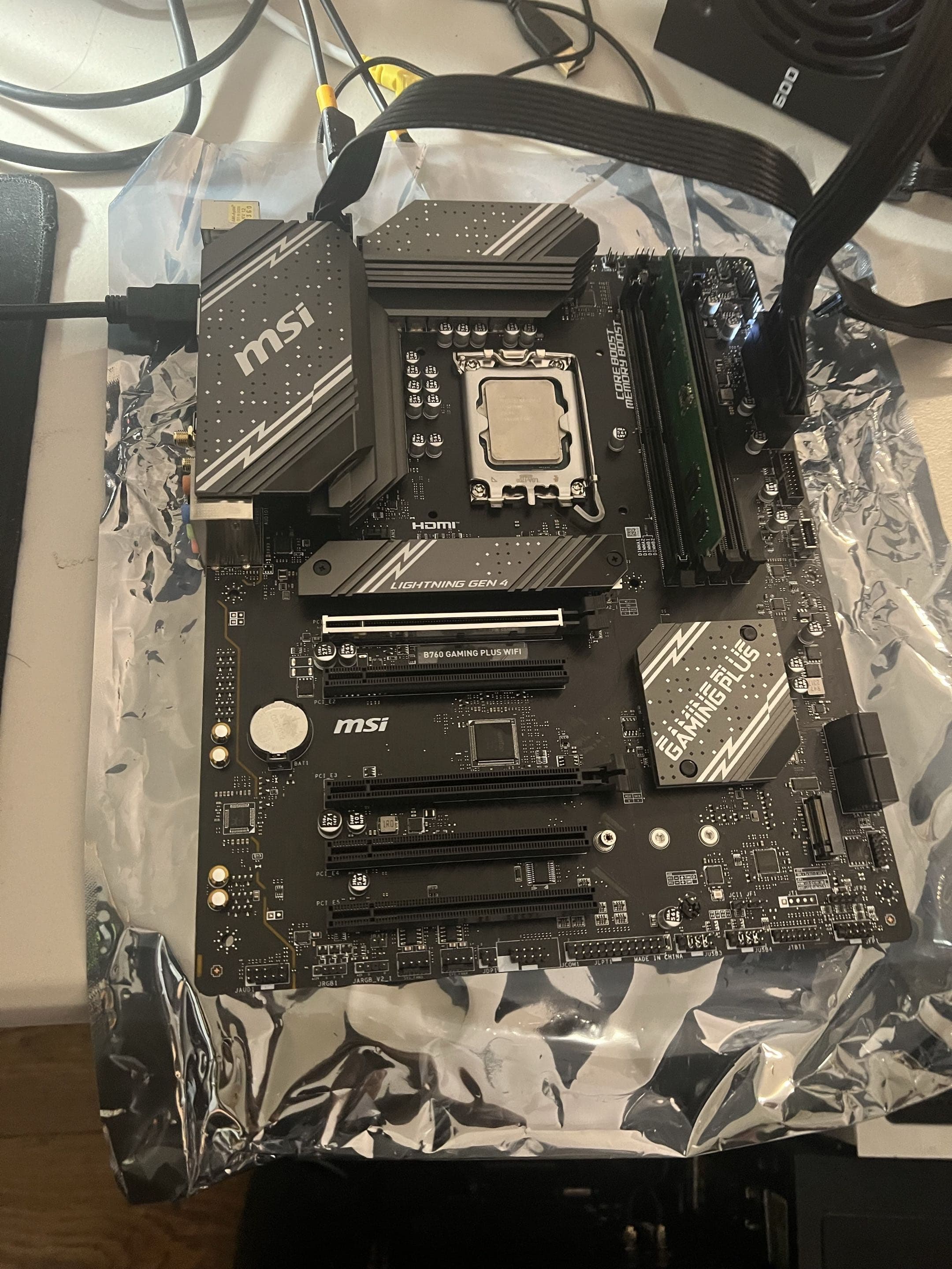Desktop motherboard with an exposed processor on an antistatic bag