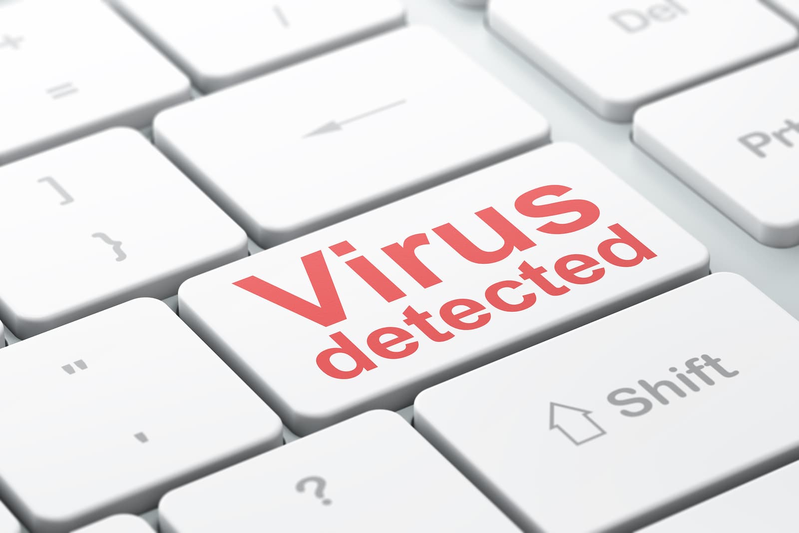 White computer keyboard with a red Virus detected key